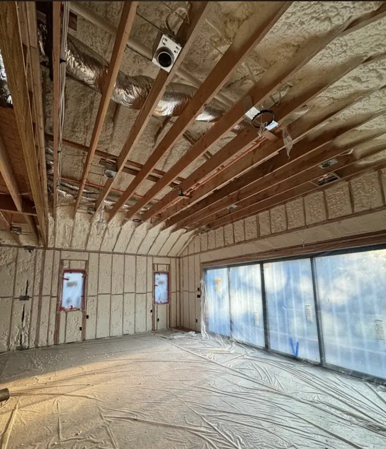 Interior walls and ceiling insulated with spray foam during new construction in Roxbury